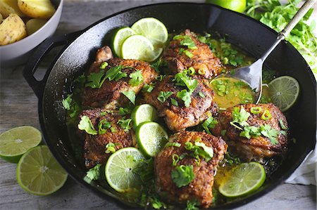 pan fried - Chicken thighs with lime Stock Photo - Premium Royalty-Free, Code: 659-08419272