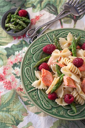 simsearch:659-08939920,k - Pasta salad with salmon, asparagus, raspberries and a lemon vinaigrette Stock Photo - Premium Royalty-Free, Code: 659-08419323