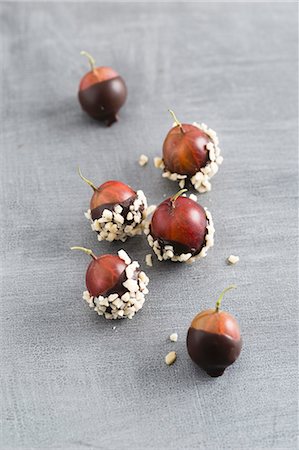 Chocolate-coated gooseberries and chopped almonds Stock Photo - Premium Royalty-Free, Code: 659-08419444