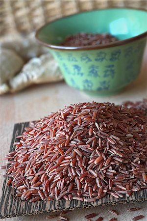 simsearch:659-01842762,k - Red rice on a wooden coconut dish (Asia) Stock Photo - Premium Royalty-Free, Code: 659-08419555