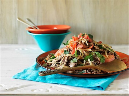 Beef steak strips with tomatoes and onions on rice (Columbia) Stock Photo - Premium Royalty-Free, Code: 659-08419621