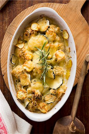 Courgette and cauliflower bake with potatoes and rosemary Stock Photo - Premium Royalty-Free, Code: 659-08419737