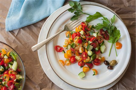 salad overhead - Israeli tomato and cucumber salad on a white plate Stock Photo - Premium Royalty-Free, Code: 659-08419754