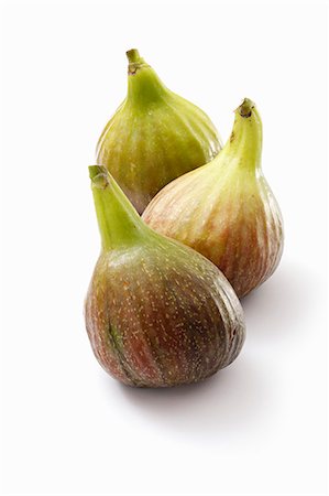 simsearch:659-08420299,k - Three fresh figs on a white surface Stock Photo - Premium Royalty-Free, Code: 659-08419911