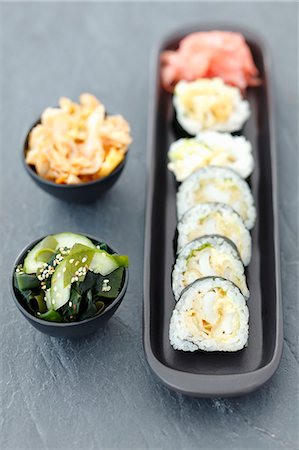 sepia toned - Sushi with squid in tempura, wakame and kimchi salads Stock Photo - Premium Royalty-Free, Code: 659-08419947