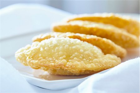 deep fried - Pastel de queijo (fried pastry parcels filled with cheese, Brazil) Stock Photo - Premium Royalty-Free, Code: 659-08420064
