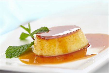 desserts on white plate - Pudim de leite moca (condensed milk flannel with caramel sauce, Brazil) Stock Photo - Premium Royalty-Free, Code: 659-08420063