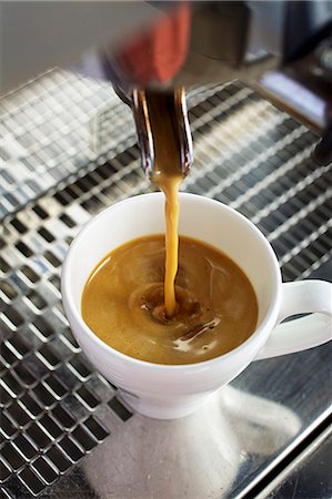 espresso close up - Coffee flowing from a coffee machine into an espresso cup Stock Photo - Premium Royalty-Free, Code: 659-08420253