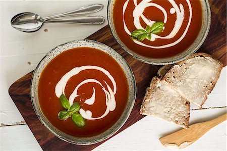 simsearch:659-08147222,k - Tomato soup with cherry, crème fraîche and basil Stock Photo - Premium Royalty-Free, Code: 659-08420265