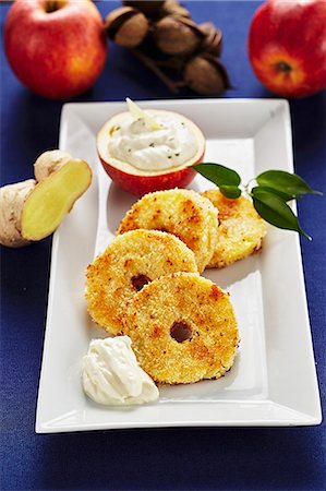 simsearch:659-08147549,k - Fried apple and coconut rings with ginger and quark cream Photographie de stock - Premium Libres de Droits, Code: 659-08420261