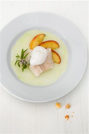 simsearch:659-08513264,k - Steamed fish flipped on a kohlrabi carpaccio with lemon foam and roasted apple wedges Stock Photo - Premium Royalty-Free, Code: 659-08512771