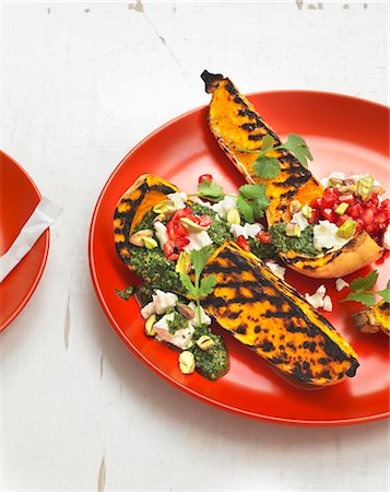 simsearch:659-08904079,k - Grilled butternut squash with coriander pesto, grapefruit, sheep's cheese and pistachio nuts Foto de stock - Sin royalties Premium, Código: 659-08512923