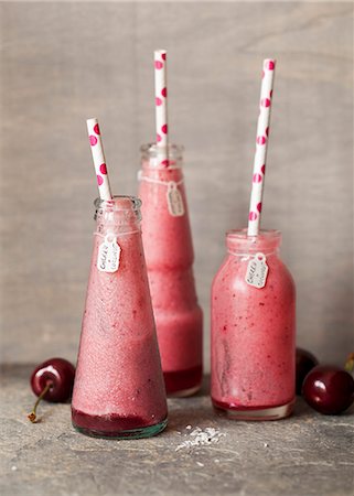 simsearch:659-03521886,k - Half-drunk cherry and coconut smoothies Stock Photo - Premium Royalty-Free, Code: 659-08513286