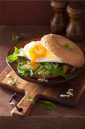 sesame beigel - A breakfast bagel with a fried egg, avocado and cheese Stock Photo - Premium Royalty-Free, Code: 659-08895241
