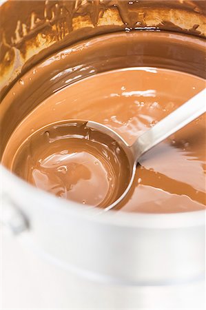 sauce in ladel - Chocolate sauce in a saucepan with a ladle Stock Photo - Premium Royalty-Free, Code: 659-08895331