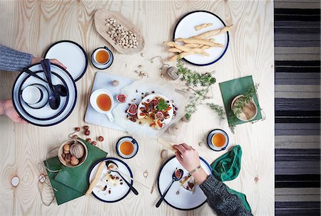 Brie with nuts, dried fruits and rosemary honey for Christmas Stock Photo - Premium Royalty-Free, Code: 659-08895542