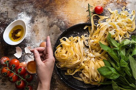 Tagliatelle, tomatoes, herbs and eggs Stock Photo - Premium Royalty-Free, Code: 659-08895847