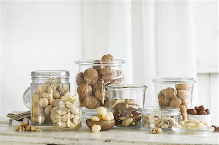 simsearch:659-08419994,k - Various types of nut in glass jars on a rustic kitchen table Stock Photo - Premium Royalty-Free, Code: 659-08896098