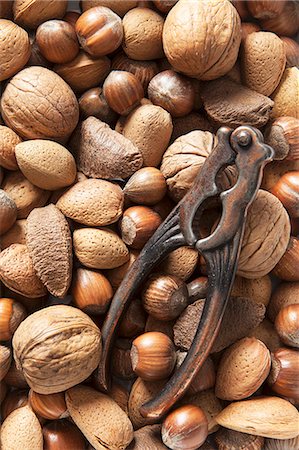 pit (seed) - Various nuts and a vintage nutcracker Stock Photo - Premium Royalty-Free, Code: 659-08896146