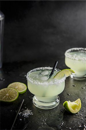 simsearch:659-06187837,k - Margarita cocktail with salted rim glass, lime and tequilla Photographie de stock - Premium Libres de Droits, Code: 659-08896448