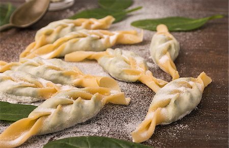 spinach pasta - Turtei, a braided ravioli made with fresh eggs and semolina filled with ricotta and spinach Stock Photo - Premium Royalty-Free, Code: 659-08896946