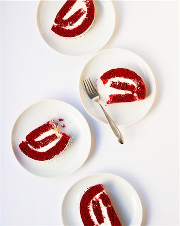 piece cake aerial view - Slices of red velvet cake roll on dessert plates Stock Photo - Premium Royalty-Free, Code: 659-08897332