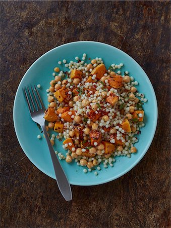 simsearch:659-08904671,k - Giant couscous salad with squash, chickpeas and chilli flakes Stock Photo - Premium Royalty-Free, Code: 659-08904027