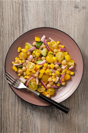 simsearch:659-08904671,k - A yellow vegetable salad with tomatoes, sweetcorn, peppers and chickpeas Stock Photo - Premium Royalty-Free, Code: 659-08904179