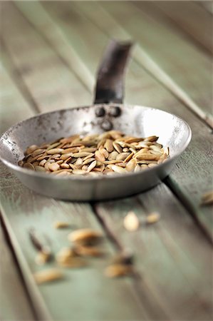simsearch:625-01251856,k - A pan of roasted pumpkin seeds Stock Photo - Premium Royalty-Free, Code: 659-08904225