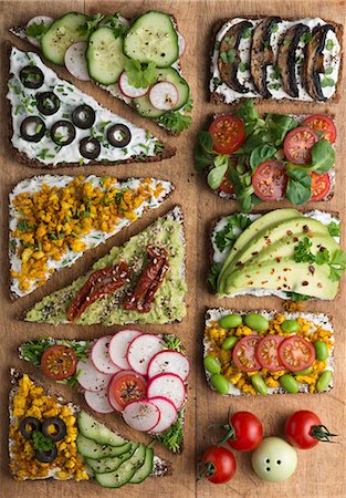 simsearch:700-06809021,k - Wholemeal open sandwiches topped with soya quark and various vegetables Stock Photo - Premium Royalty-Free, Code: 659-08904460