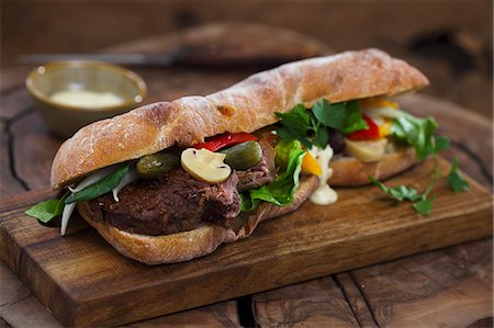 Baguette sandwich with beef and mixed pickles Stock Photo - Premium Royalty-Free, Code: 659-08904860