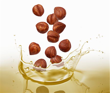 simsearch:659-08419920,k - Hazelnuts falling into oil Stock Photo - Premium Royalty-Free, Code: 659-08904945