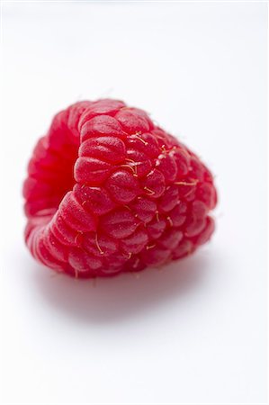 simsearch:659-06187989,k - A raspberry on a white surface Stock Photo - Premium Royalty-Free, Code: 659-08905254