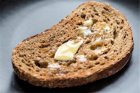 simsearch:659-06151745,k - A slice of wholemeal toast with melting butter Stock Photo - Premium Royalty-Free, Code: 659-08905449