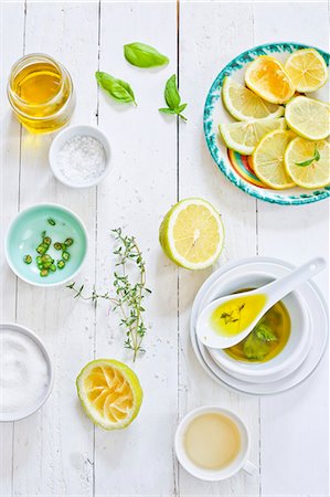 shabby chic - Italian vinaigrette and ingredients on a white wooden table Stock Photo - Premium Royalty-Free, Code: 659-08905496