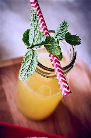 simsearch:659-07597739,k - Fruit juice in a bottle with fresh mint and a straw Stock Photo - Premium Royalty-Free, Code: 659-08905697