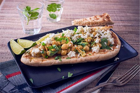 flat bread - A naan bread with chickpeas and feta Stock Photo - Premium Royalty-Free, Code: 659-08905794