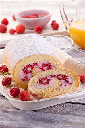 simsearch:659-07028819,k - A Swiss roll with raspberries and icing sugar Stock Photo - Premium Royalty-Free, Code: 659-08905830