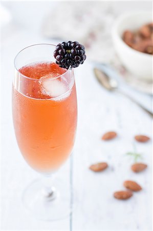 simsearch:659-07609974,k - A kir cocktail with a blackberry and an ice cube Stock Photo - Premium Royalty-Free, Code: 659-08906021