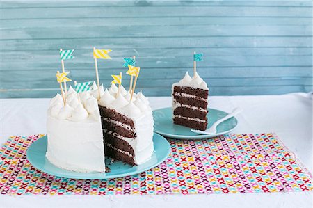 A chocolate birthday cake with cream cheese frosting Stock Photo - Premium Royalty-Free, Code: 659-08906211
