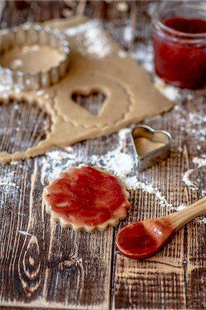 simsearch:659-08896310,k - Jam being spread onto unbaked vegan shortbread biscuits Stock Photo - Premium Royalty-Free, Code: 659-08906461