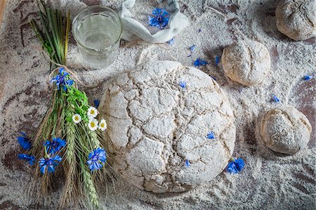 simsearch:659-06154846,k - And unbaked loaf of bread and bread rolls withflower, water and ears of corn Stock Photo - Premium Royalty-Free, Code: 659-08906489