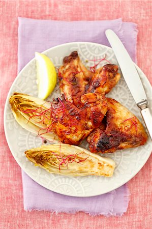 simsearch:659-08906711,k - Grilled chicken wings with baked chicory Photographie de stock - Premium Libres de Droits, Code: 659-08906715