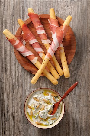 Grissini with Parma ham and a pine nut dip Stock Photo - Premium Royalty-Free, Code: 659-08902582