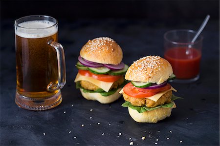 Homemade vegetarian quinoa burgers and a glass of beer Stock Photo - Premium Royalty-Free, Code: 659-08902636