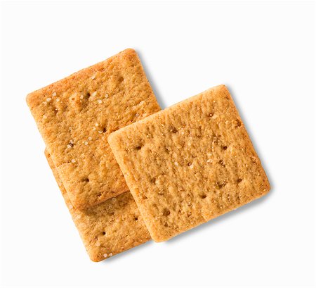 simsearch:614-06336019,k - Three wheat crackers on a white surface (close-up) Stock Photo - Premium Royalty-Free, Code: 659-08902695