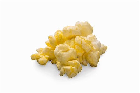 simsearch:659-08902725,k - Buttered popcorn on a white surface (close-up) Foto de stock - Sin royalties Premium, Código: 659-08902697