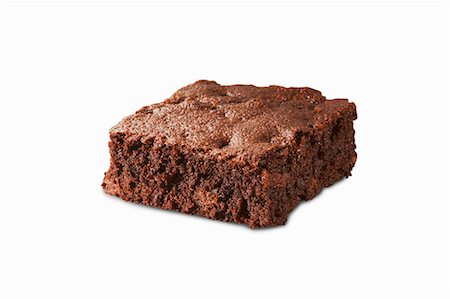 simsearch:659-08903311,k - A fudgy brownie on a white surface Photographie de stock - Premium Libres de Droits, Code: 659-08902709