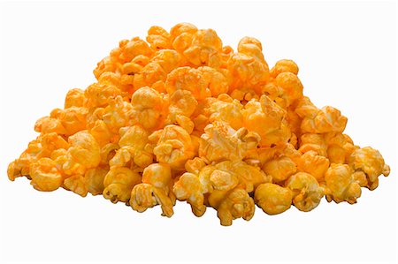 simsearch:659-08902725,k - A pile of cheddar popcorn on a white surface Foto de stock - Sin royalties Premium, Código: 659-08902701