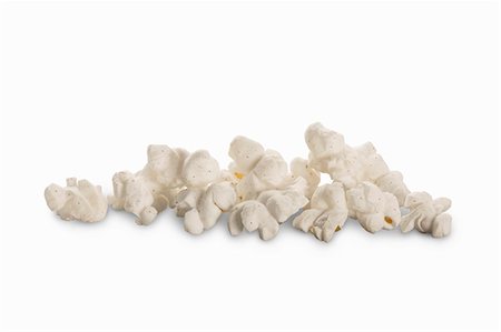 popcorn white background - Salty popcorn on a white surface Stock Photo - Premium Royalty-Free, Code: 659-08902719